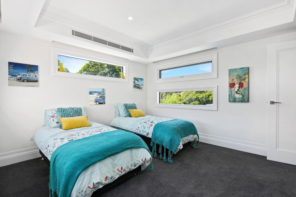 This is an example of a contemporary guest bedroom in Melbourne with white walls, carpet and grey floor.