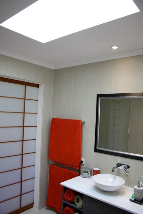 Inspiration for a large asian master bathroom in Brisbane with a vessel sink, flat-panel cabinets, grey cabinets, engineered quartz benchtops, an open shower, a wall-mount toilet, beige tile, porcelain tile, beige walls and porcelain floors.