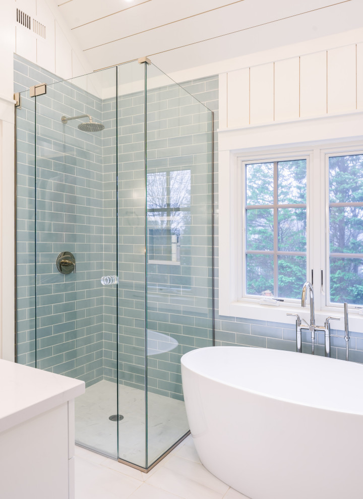 Example of a mid-sized farmhouse master blue tile and ceramic tile walk-in shower design in Raleigh with white cabinets, an undermount sink, quartz countertops, a hinged shower door, white countertops and a built-in vanity