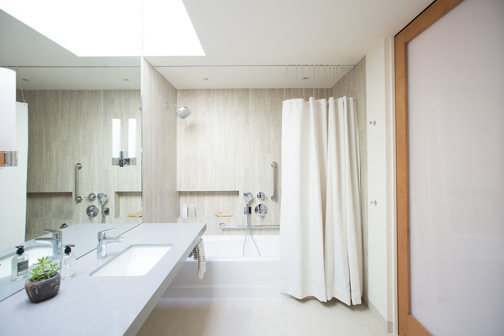 Mid-sized contemporary 3/4 bathroom in Santa Barbara with an alcove tub, a curbless shower, porcelain tile, white walls, porcelain floors, an undermount sink, engineered quartz benchtops, grey floor, grey benchtops, gray tile and a shower curtain.