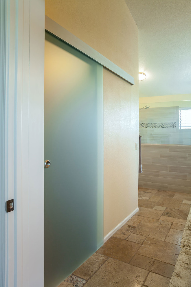 Inspiration for a large transitional master brown tile and porcelain tile ceramic tile walk-in shower remodel in Phoenix with recessed-panel cabinets, dark wood cabinets, a two-piece toilet, beige walls, an undermount sink and granite countertops