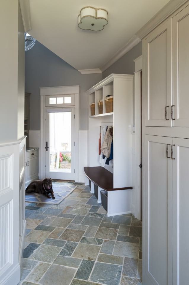 Inspiration for a mid-sized traditional galley utility room in Cincinnati with shaker cabinets, white cabinets, granite benchtops, grey walls, limestone floors and grey floor.