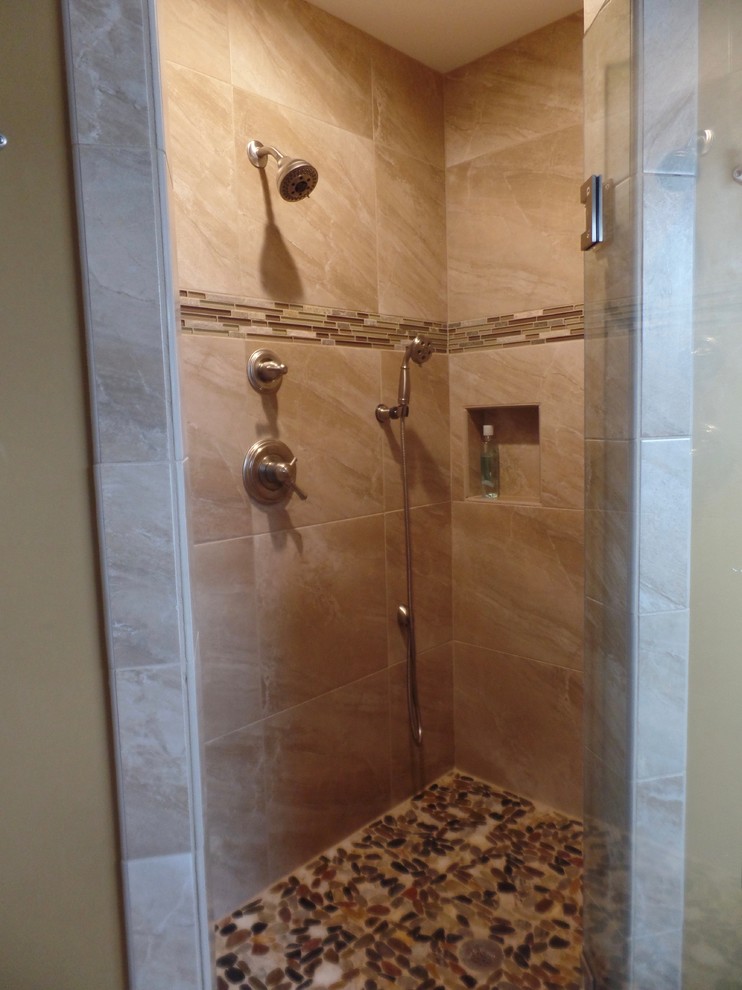 Mid-sized transitional master bathroom in Other with a corner shower, beige tile and porcelain tile.