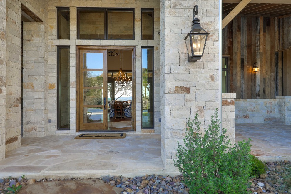 Design ideas for a country front door in Austin with a double front door and a medium wood front door.