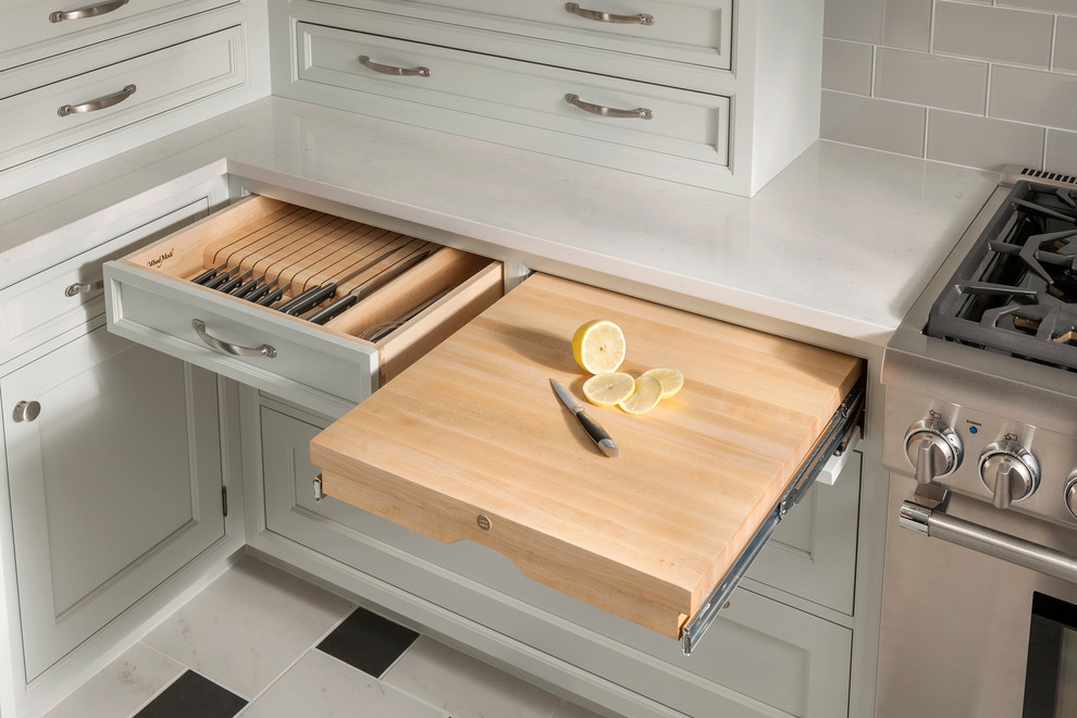 Example of a classic kitchen design with white cabinets