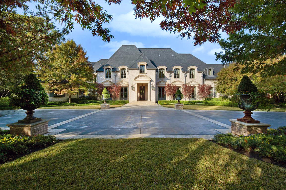 Traditional exterior in Dallas with stone veneer.