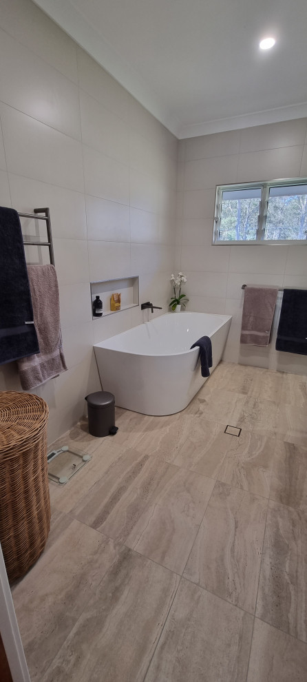 Large master bathroom in Sydney with flat-panel cabinets, white cabinets, a corner tub, an alcove shower, a two-piece toilet, beige tile, ceramic tile, beige walls, ceramic floors, an undermount sink, engineered quartz benchtops, beige floor, a hinged shower door, white benchtops, a single vanity, a floating vanity and recessed.