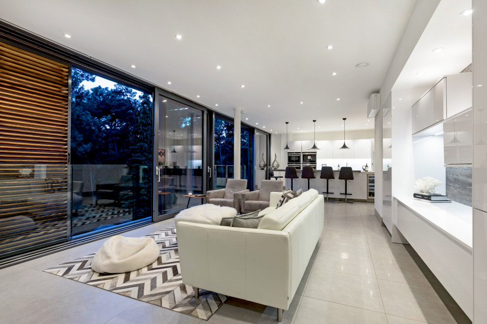 Photo of a large contemporary open plan living room in Dorset with white walls.