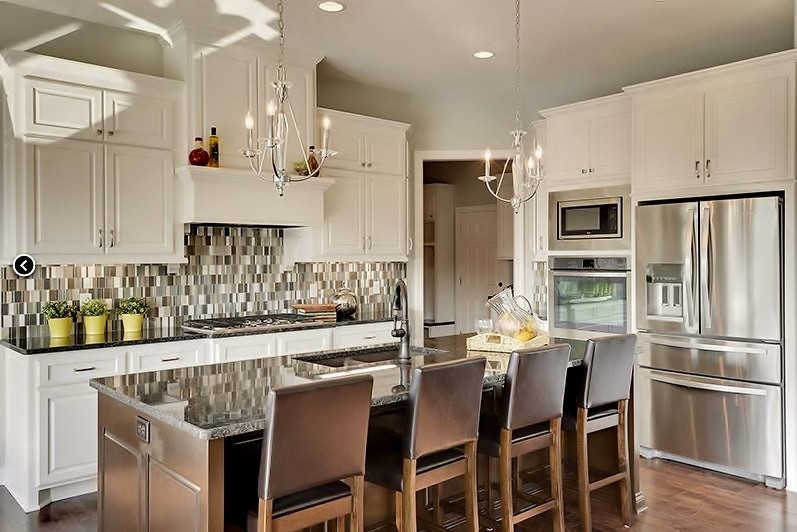 Inspiration for a mid-sized eat-in kitchen remodel in Minneapolis with an island