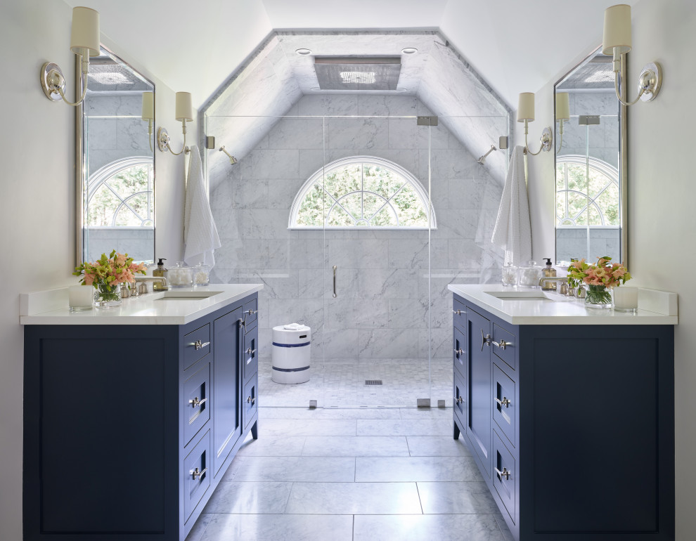 Photo of a large transitional master bathroom in Boston with shaker cabinets, blue cabinets, white tile, marble, grey walls, marble floors, an undermount sink, engineered quartz benchtops, a hinged shower door, white benchtops, grey floor, a single vanity, a freestanding vanity and vaulted.