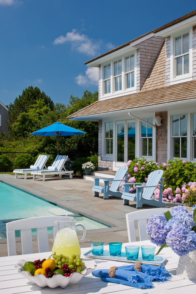 Inspiration for a large beach style side yard rectangular lap pool in Boston with a hot tub and concrete pavers.