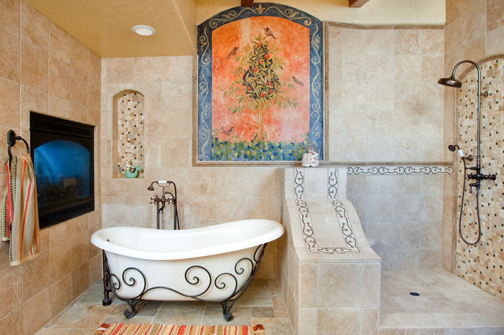 Inspiration for a mid-sized mediterranean master bathroom in San Luis Obispo with a claw-foot tub, an open shower, beige tile, stone tile, beige walls, travertine floors, beige floor and an open shower.