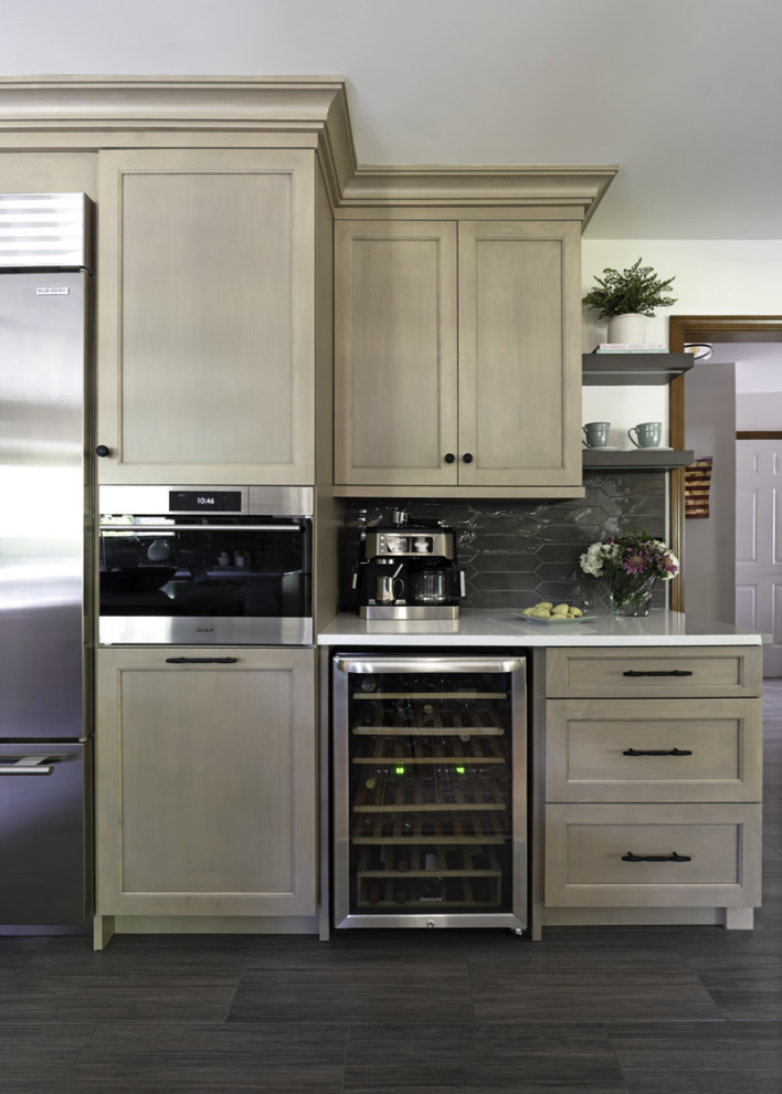 Example of a large transitional kitchen design in Chicago with recessed-panel cabinets, light wood cabinets, quartz countertops, gray backsplash, porcelain backsplash, an island and white countertops