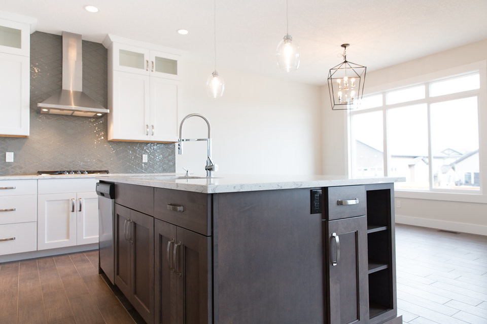 Example of a transitional kitchen design in Calgary