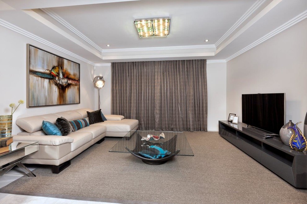 Photo of a mid-sized modern enclosed home theatre in Perth with beige walls, carpet and beige floor.