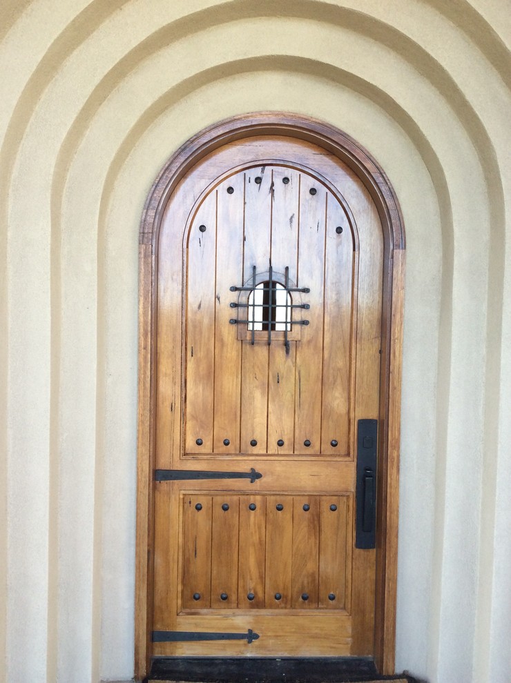 Mid-sized arts and crafts front door in Denver with a single front door and a light wood front door.