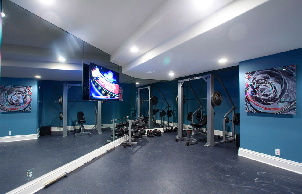 Photo of a transitional home gym in Omaha with blue floor.
