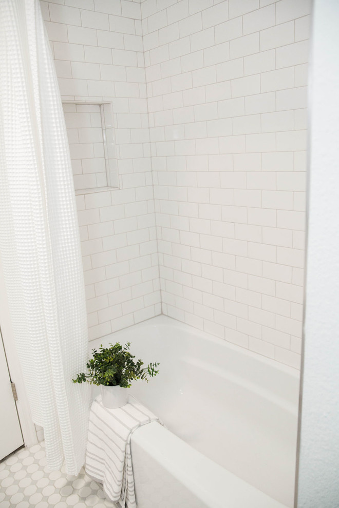 This is an example of a small beach style kids bathroom in Phoenix with white cabinets, a drop-in tub, a shower/bathtub combo, white tile, subway tile, green walls, mosaic tile floors, a drop-in sink, engineered quartz benchtops, white floor, a shower curtain and white benchtops.