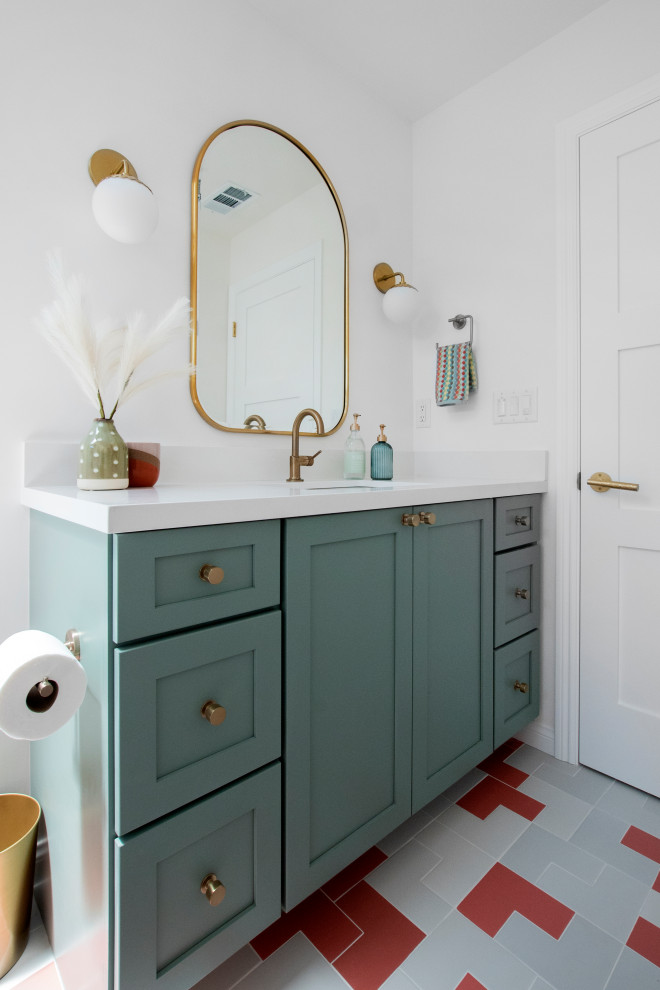Inspiration for a mid-sized transitional kids bathroom in San Francisco with shaker cabinets, green cabinets, an alcove tub, a shower/bathtub combo, a one-piece toilet, white tile, porcelain tile, white walls, porcelain floors, an undermount sink, engineered quartz benchtops, pink floor, a shower curtain, white benchtops, a single vanity and a built-in vanity.