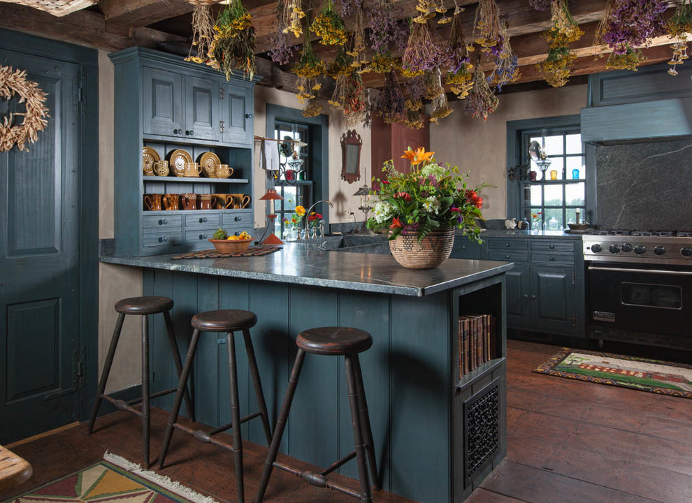 Inspiration for a country u-shaped kitchen in Boston with raised-panel cabinets, blue cabinets, a peninsula and stainless steel appliances.