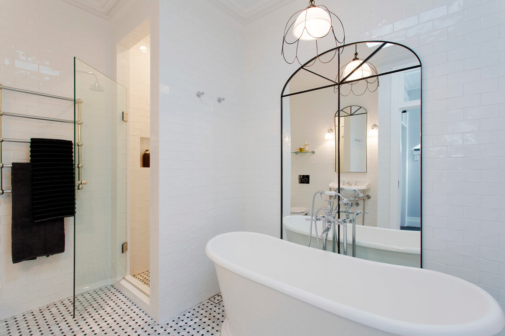 Traditional bathroom in Other with white tile, white walls and ceramic floors.