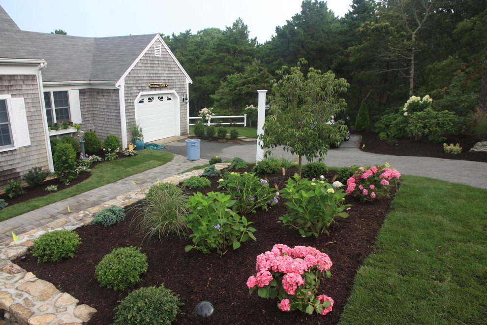 This is an example of a traditional garden in Boston with natural stone pavers.