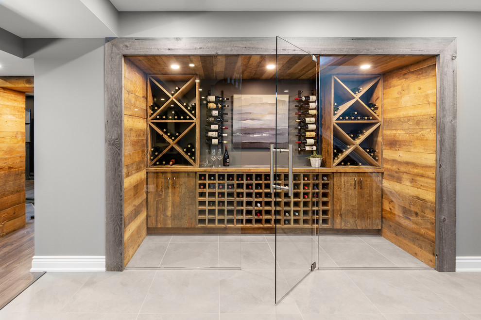 This is an example of a large contemporary wine cellar in Ottawa with diamond bins, grey floor and ceramic floors.