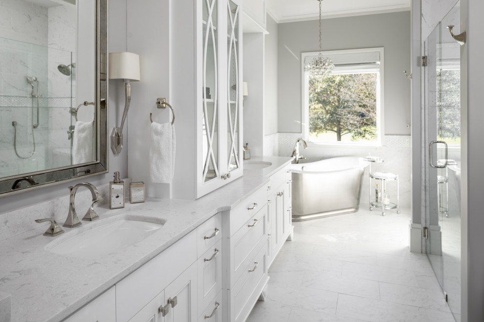 Inspiration for a mid-sized timeless master white tile and marble tile white floor, double-sink and marble floor bathroom remodel in Other with glass-front cabinets, white cabinets, an undermount sink, marble countertops, a hinged shower door, white countertops and a built-in vanity
