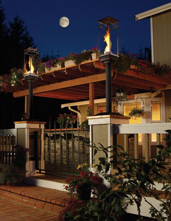 Example of a transitional backyard deck design in Seattle with a fire pit