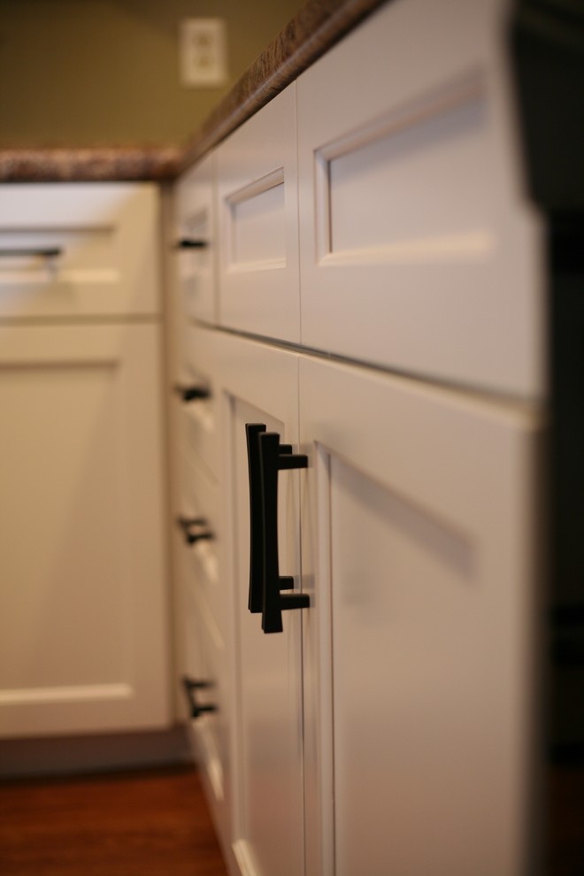 Small transitional u-shaped eat-in kitchen photo in Grand Rapids with beaded inset cabinets, white cabinets and no island