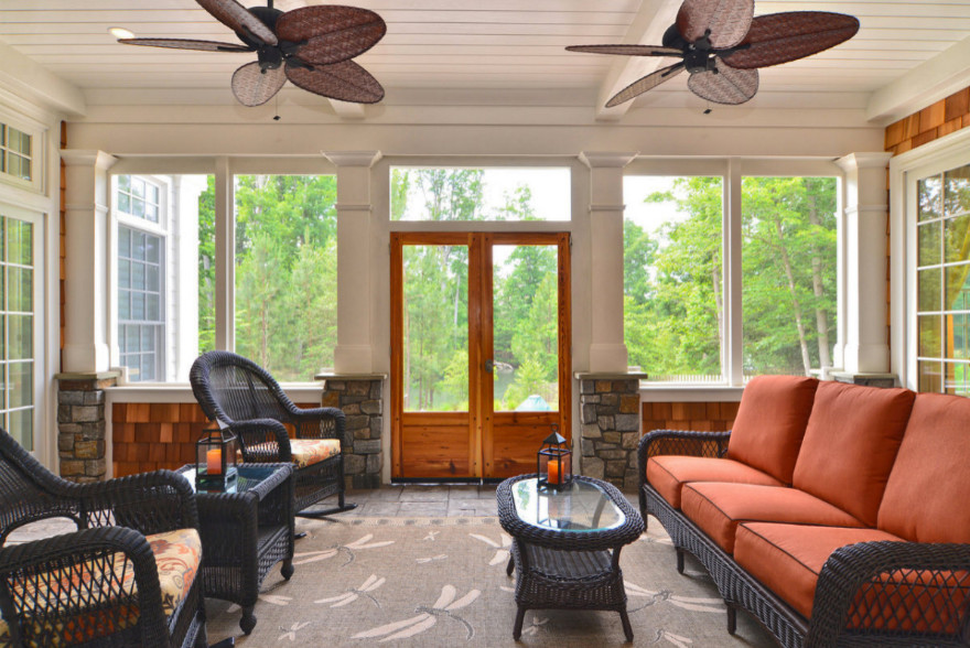 Example of a backyard balcony deck design with a roof extension