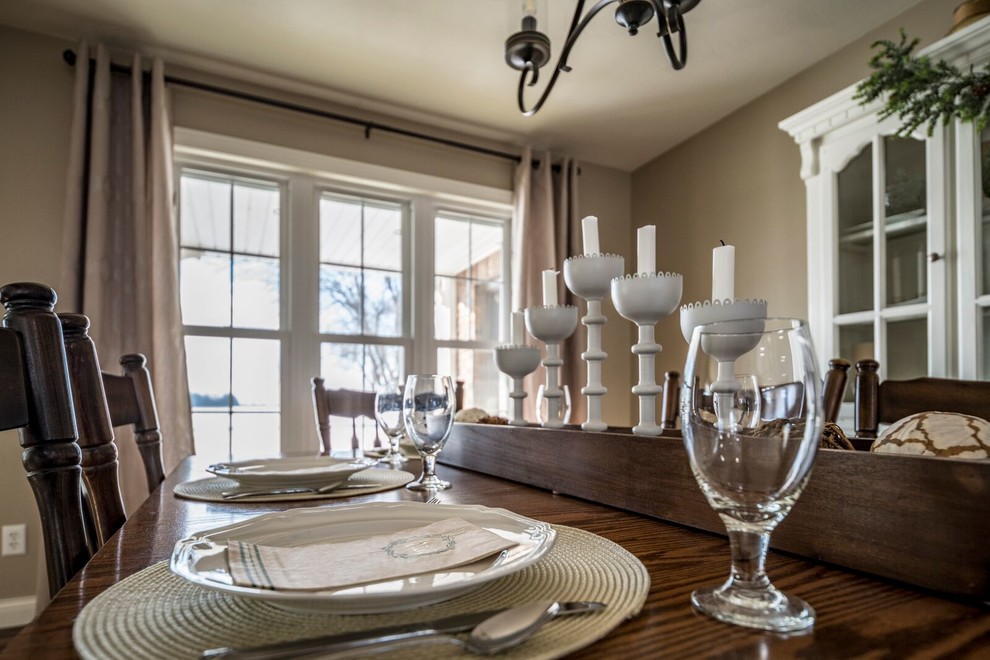 Large transitional single-wall eat-in kitchen photo with recessed-panel cabinets, white cabinets, solid surface countertops, gray backsplash, stainless steel appliances and an island