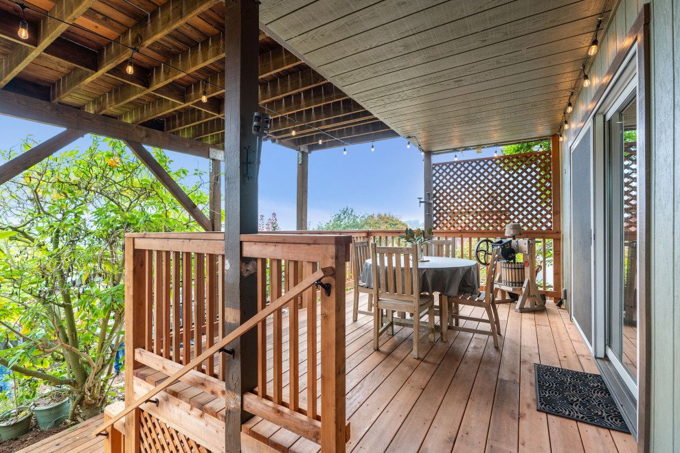 Large mountain style backyard second story wood railing deck photo in San Francisco with no cover