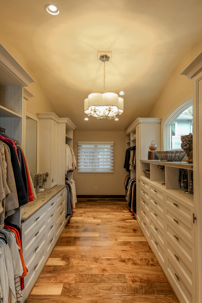 Large transitional gender-neutral walk-in wardrobe in Other with recessed-panel cabinets.