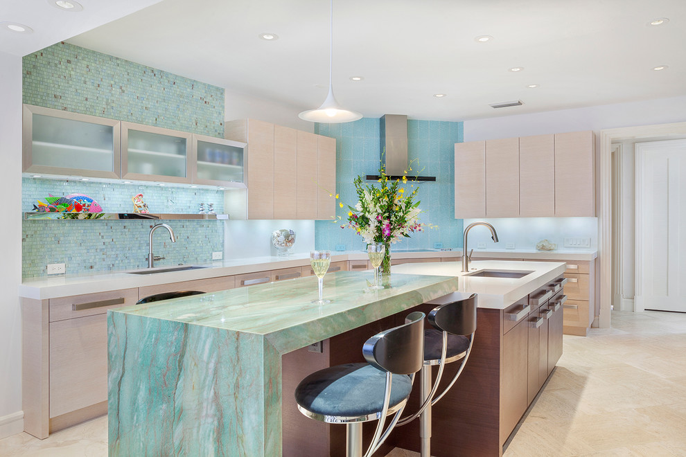 Inspiration for a large contemporary u-shaped eat-in kitchen in Miami with an undermount sink, flat-panel cabinets, light wood cabinets, granite benchtops, green splashback, glass sheet splashback, panelled appliances, marble floors, multiple islands, brown floor and green benchtop.
