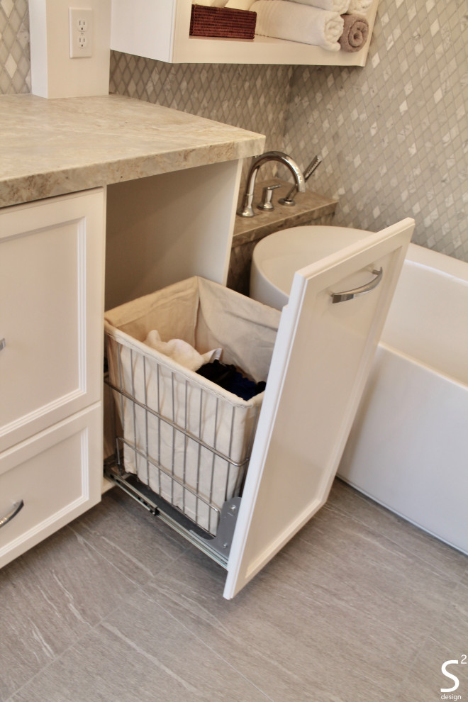 Photo of a large transitional master bathroom in Houston with recessed-panel cabinets, white cabinets, a freestanding tub, a curbless shower, a one-piece toilet, white tile, porcelain tile, grey walls, porcelain floors, an undermount sink, quartzite benchtops, grey floor, a hinged shower door, grey benchtops, an enclosed toilet, a double vanity and a built-in vanity.