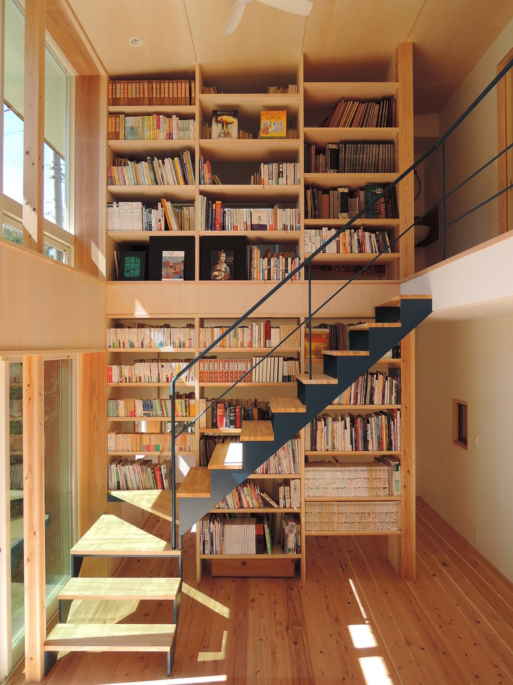 Photo of a small contemporary wood l-shaped staircase in Other with open risers.