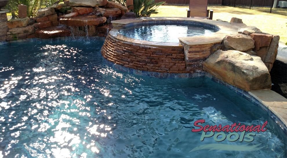 Pool fountain - large mediterranean backyard concrete and custom-shaped natural pool fountain idea