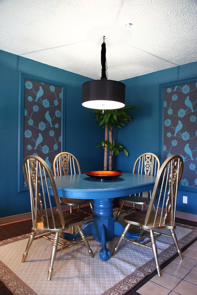 Eclectic dining room in Los Angeles with blue walls.