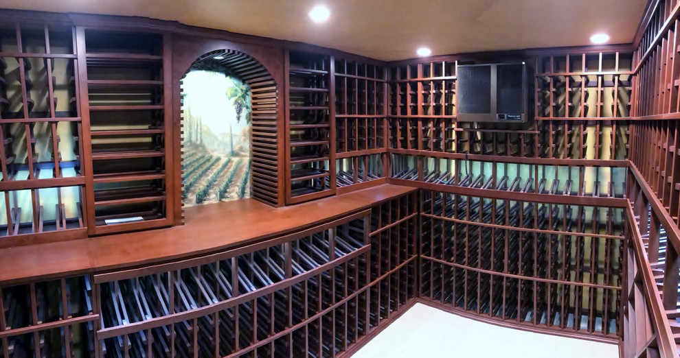 This is an example of a mid-sized traditional wine cellar in Orange County.