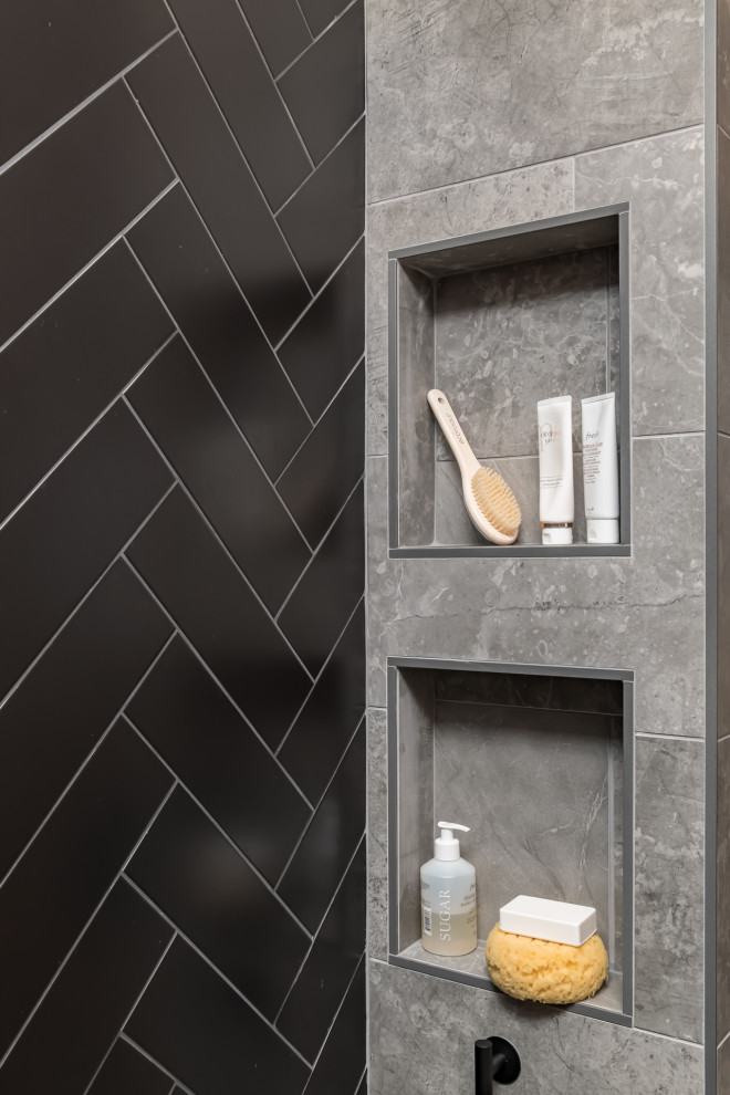Inspiration for a mid-sized modern master bathroom in Atlanta with flat-panel cabinets, grey cabinets, a drop-in tub, gray tile, porcelain tile, granite benchtops, grey benchtops, a single vanity and a built-in vanity.