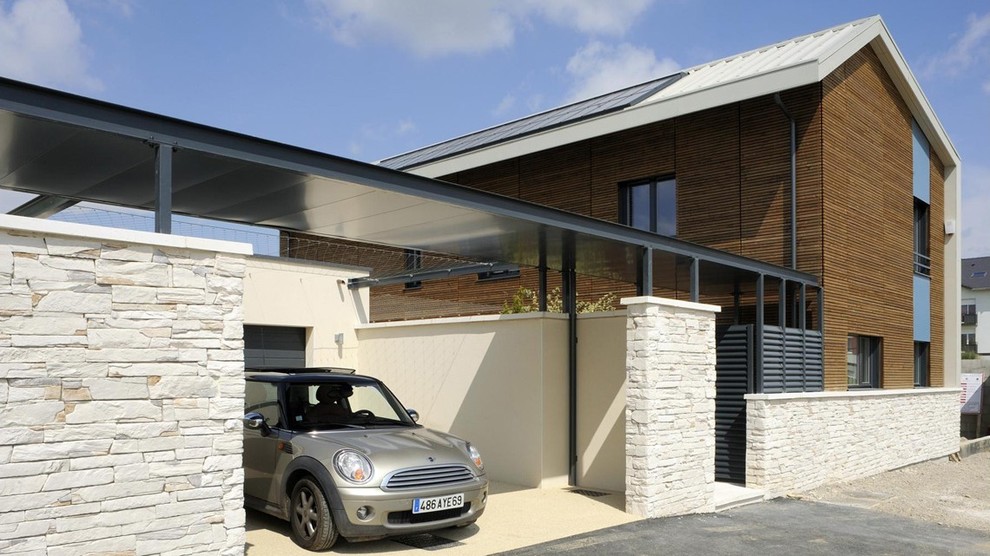 Mid-sized contemporary detached one-car carport in Lyon.