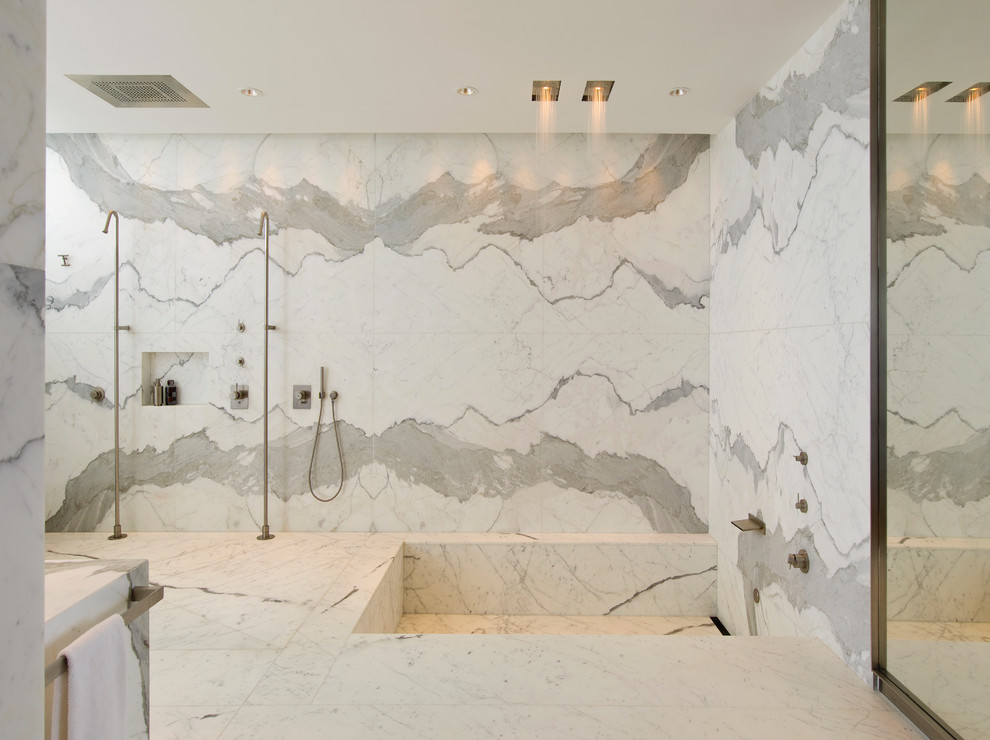 This is an example of a large contemporary master wet room bathroom in Miami with a corner tub, white tile, gray tile, white walls, white floor, an open shower, marble, marble benchtops and grey benchtops.