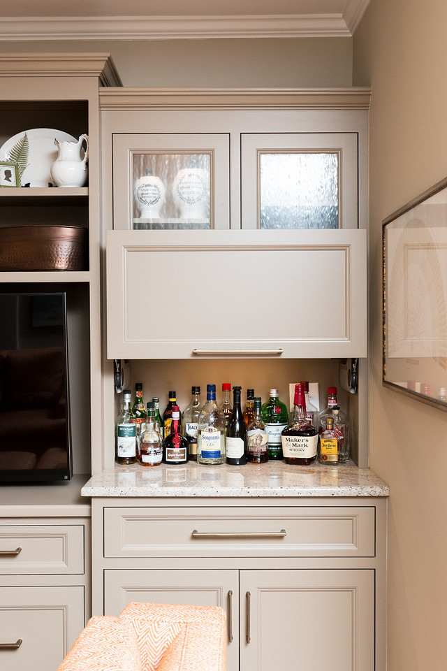 This is an example of a medium sized classic home bar in Charlotte.