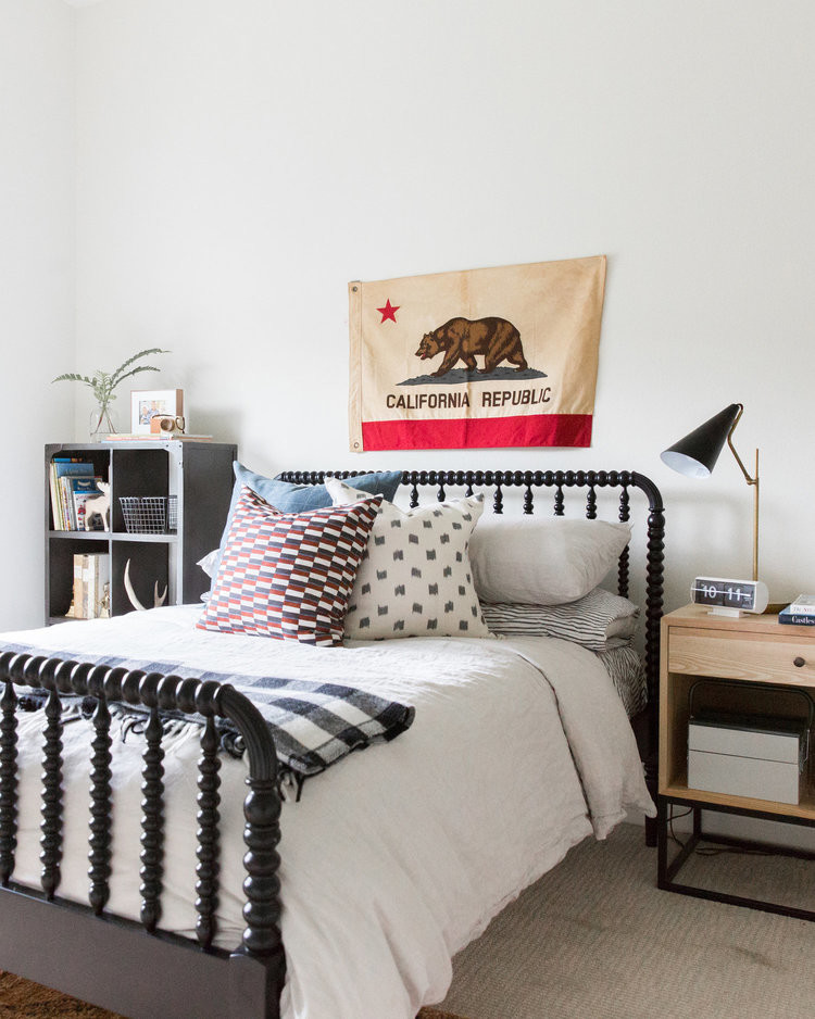 Beach style gender-neutral kids' room in Salt Lake City with white walls, carpet and beige floor.