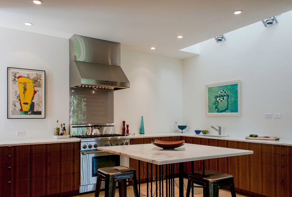 Example of a trendy kitchen design in DC Metro with flat-panel cabinets, medium tone wood cabinets and stainless steel appliances