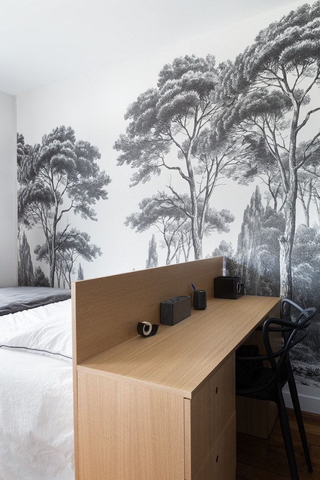 This is an example of a small scandinavian bedroom in Paris with black walls, medium hardwood floors and beige floor.