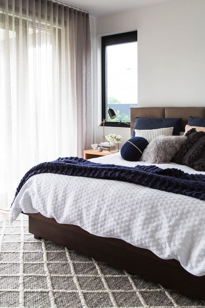 Design ideas for a contemporary master bedroom in Melbourne with white walls.