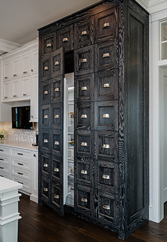 Open concept kitchen - large transitional galley dark wood floor and brown floor open concept kitchen idea with a double-bowl sink, recessed-panel cabinets, white cabinets, white backsplash, stainless steel appliances and two islands