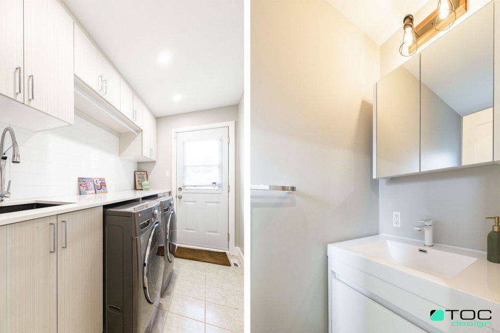 Large contemporary galley utility room in Montreal with an undermount sink, flat-panel cabinets, light wood cabinets, quartz benchtops, white splashback, cement tile splashback, grey walls, ceramic floors, a side-by-side washer and dryer, beige floor and white benchtop.